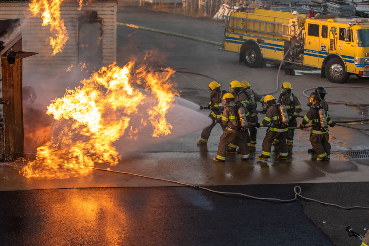 Fire fighters extinguishing a building fire